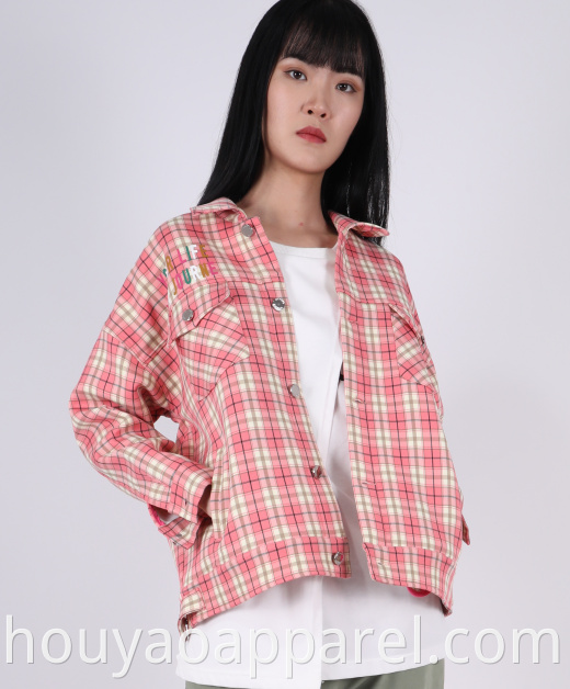 Cropped check coat with a lapel collar and long sleeves with buttoned tab detail